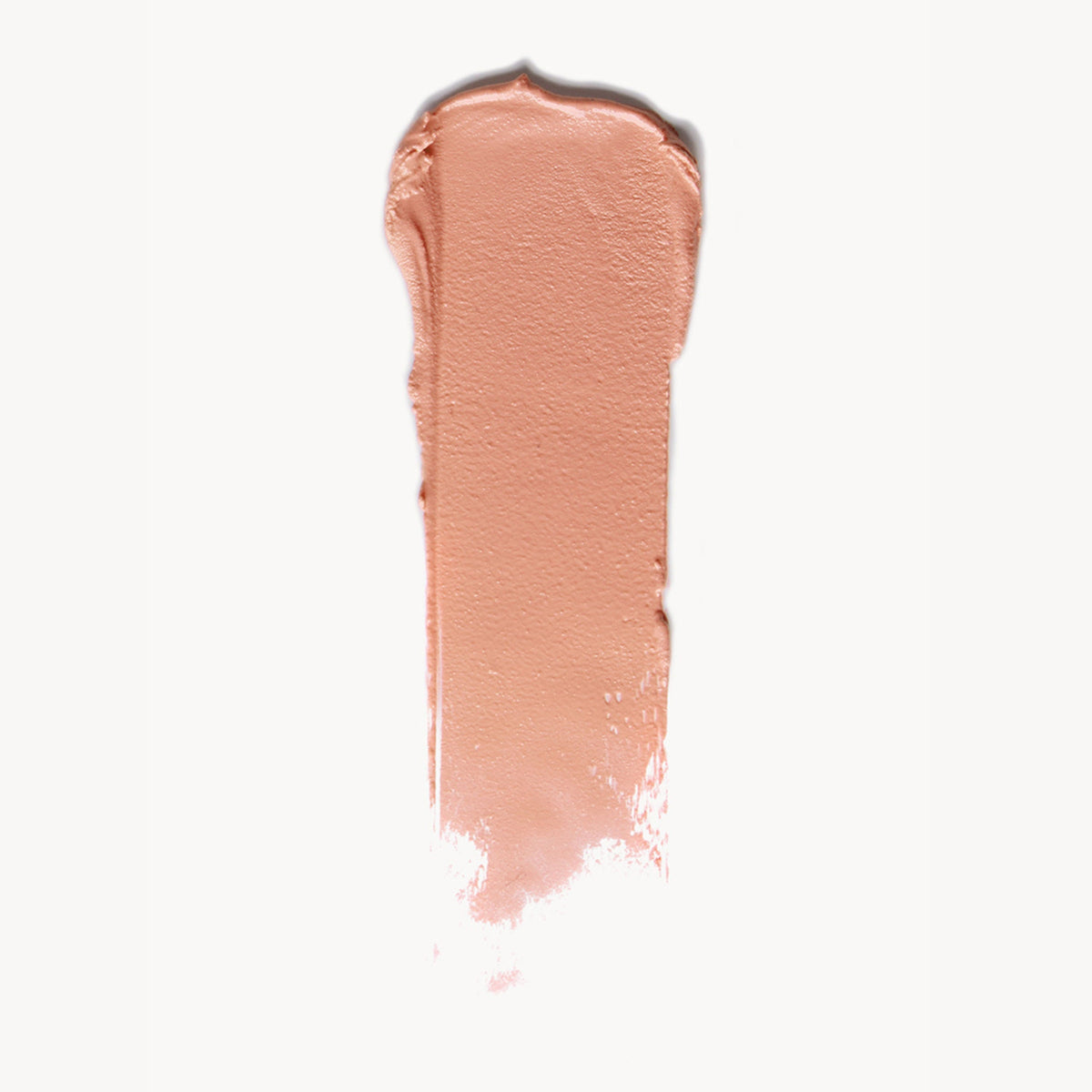 A wipe of soft peach cream blush on a white background