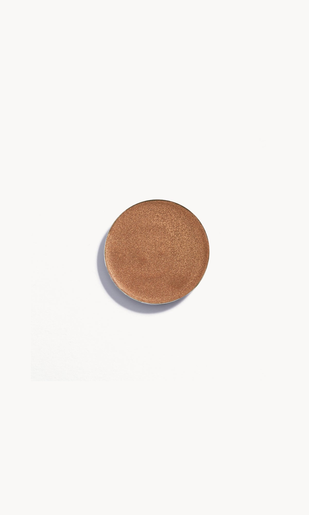 Refill pan of the Kjaer Weis Cream Eye Shadow in the shade Alluring, a medium gold with light reflecting shimmer.