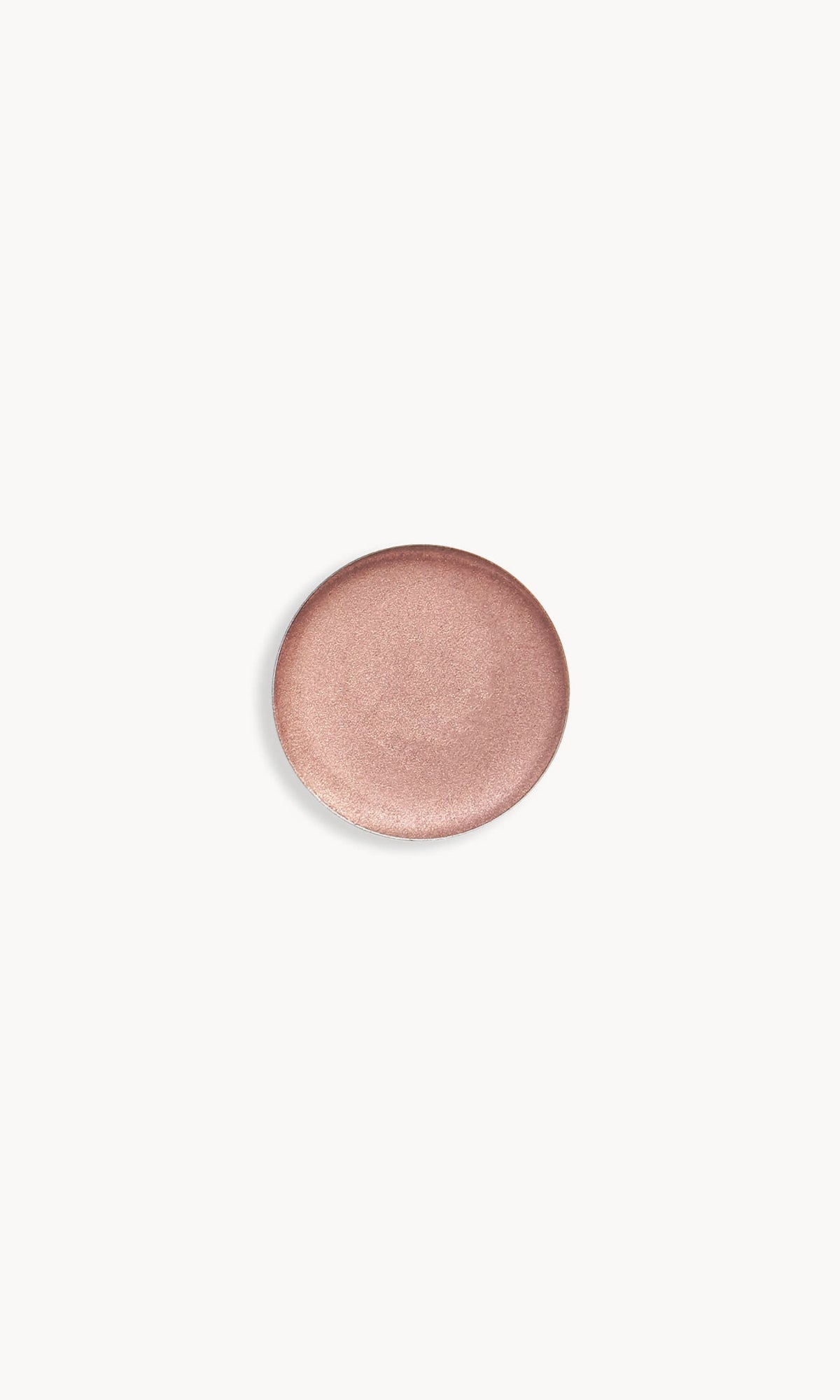Refill pan of the Kjaer Weis Cream Eye Shadow in the shade Luminescence, a light pink with light reflecting shimmer.