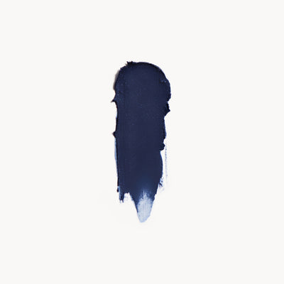 Navy blue cream eye shadow swatch on a white background