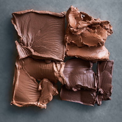 Close-up of Kjaer Weis Cream Bronzer, showcasing the texture of the cream formula.