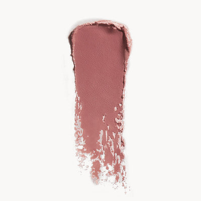 Nude-colored lipstick swatch on a white background