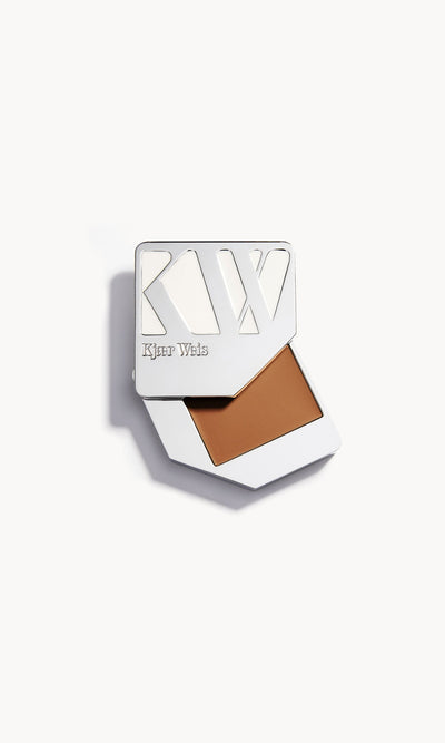 Solid metal palette with the lid slid open to show the cream foundation